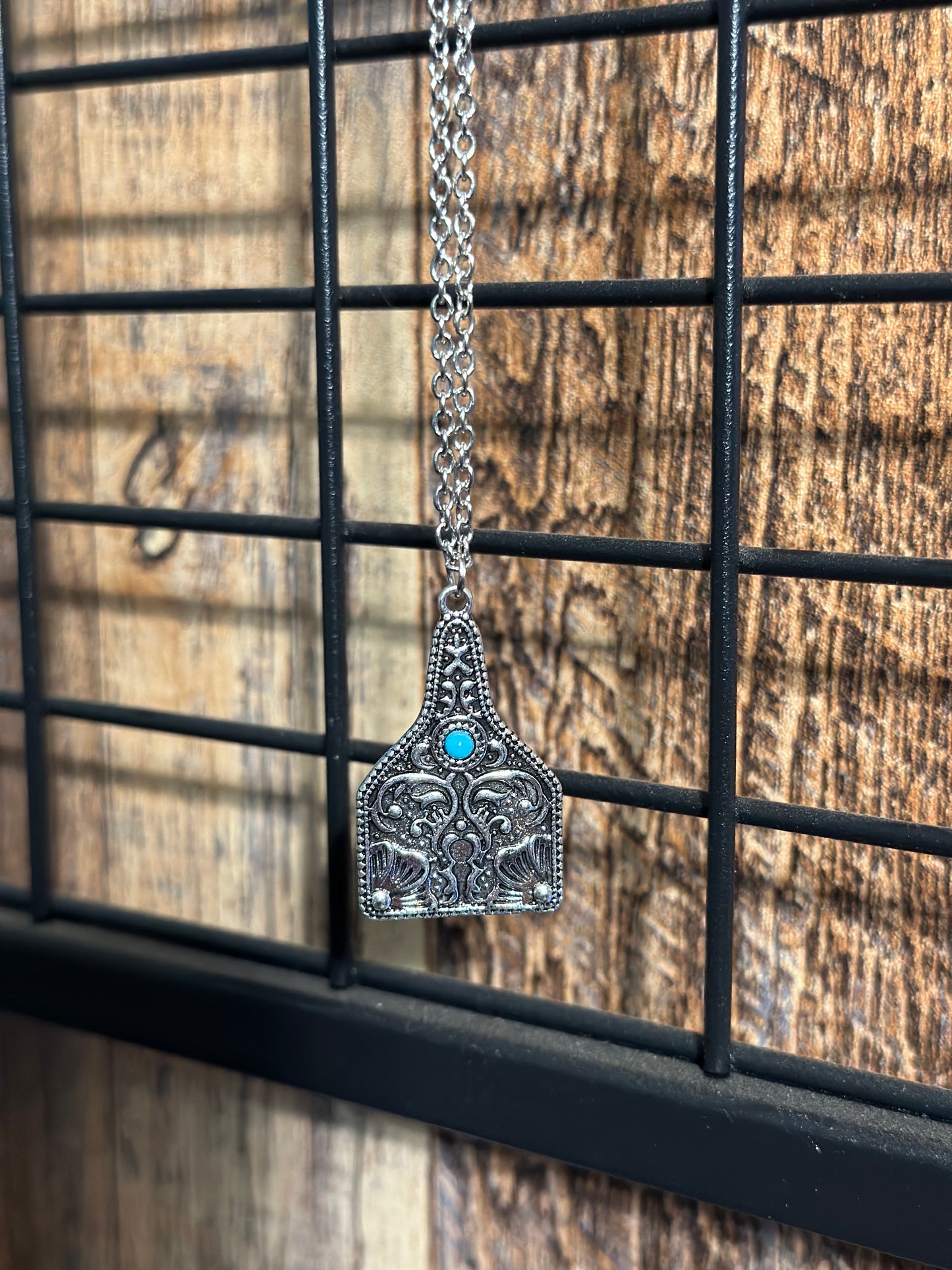 Turquoise and Tooled Cow Tag Necklace